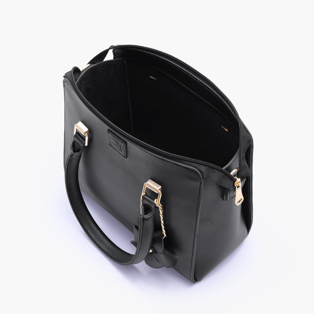 Black handbag with flower charm
