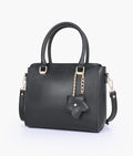 Black handbag with flower charm